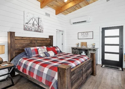 A large comfy king size bed sits in the Whispering Pines bedroom.