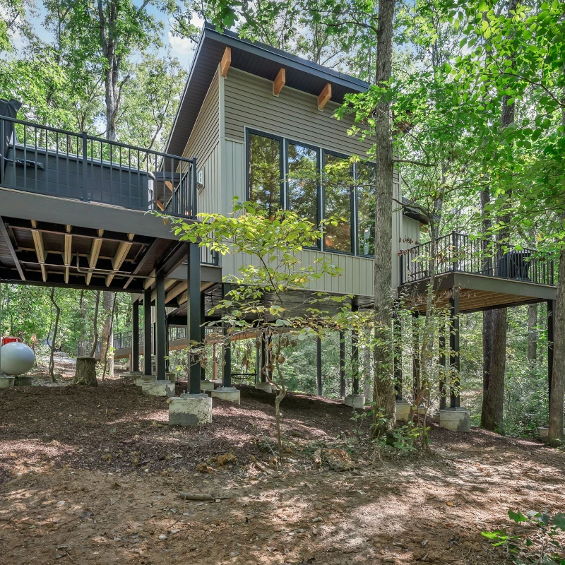 Whispering Pines - Twilight - A Beautiful Getaway A large hot tub sits overlooking a private lake at Whispering Pines cabin.